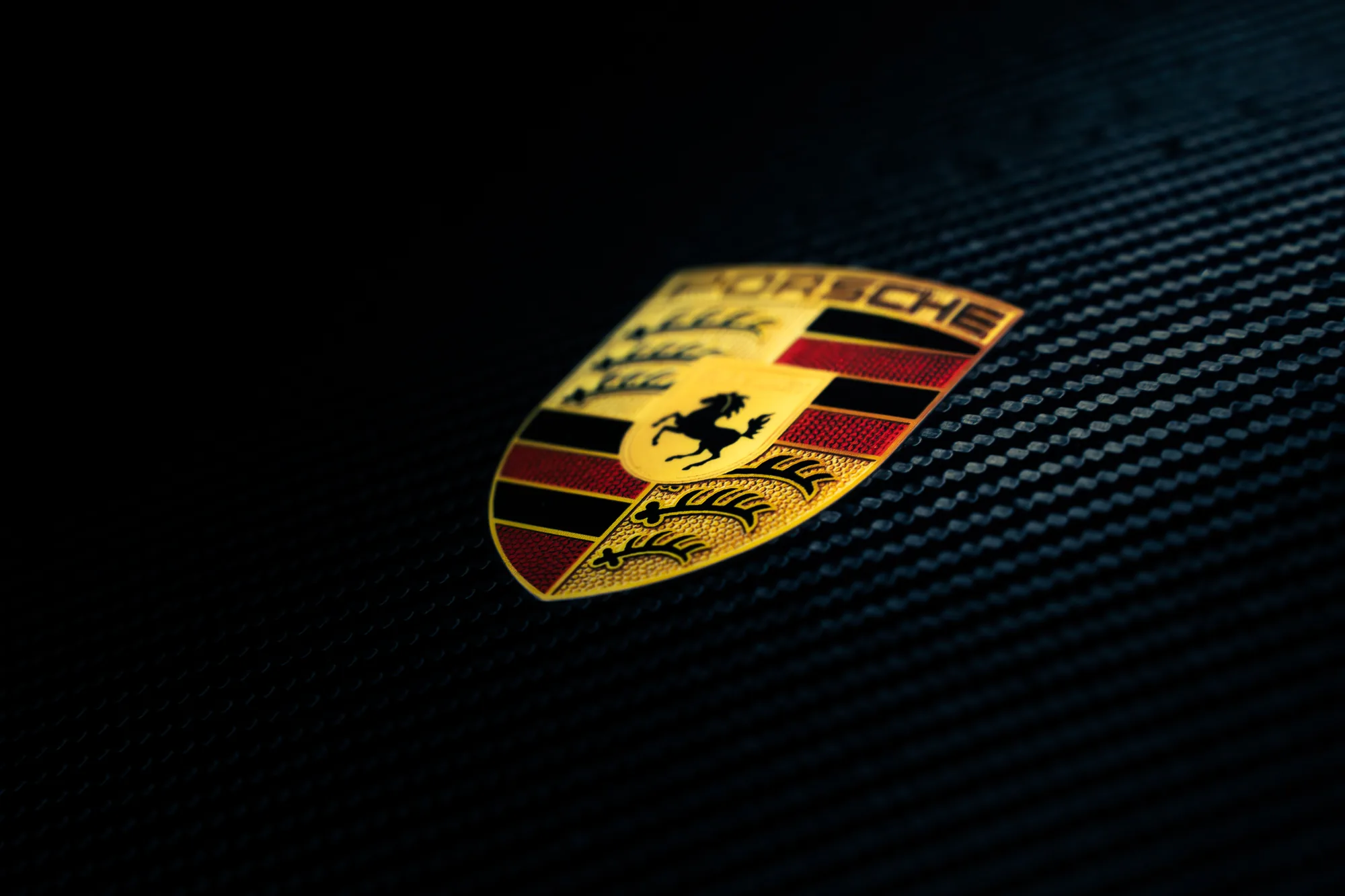 Porsche crest on carbon fiber